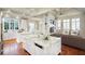 Open-concept kitchen and living room with hardwood floors and natural light at 3370 Habersham Nw Rd, Atlanta, GA 30305