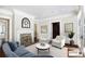 Bright living room with fireplace, accent chairs, and hardwood floors at 3370 Habersham Nw Rd, Atlanta, GA 30305
