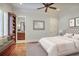 Comfortable main bedroom with a window seat, bedside table and attached bathroom at 3370 Habersham Nw Rd, Atlanta, GA 30305