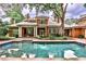 Backyard pool with patio, seating area, and red brick home exterior at 3370 Habersham Nw Rd, Atlanta, GA 30305