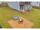 Spacious backyard featuring a fire pit area and seating for outdoor enjoyment at 3510 Meadow Grass Dr, Dacula, GA 30019