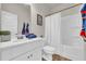 Bright bathroom with a white vanity, a tub and shower combination, and modern fixtures at 3510 Meadow Grass Dr, Dacula, GA 30019