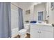 Bathroom with blue patterned shower curtain, white vanity, and modern fixtures at 3510 Meadow Grass Dr, Dacula, GA 30019