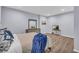 Bedroom featuring hard surface flooring, a dresser, and a bed with blue blanket and pillows at 3510 Meadow Grass Dr, Dacula, GA 30019