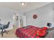 Spacious bedroom featuring two entryways, grey walls, a decorative bed, and a ceiling fan at 3510 Meadow Grass Dr, Dacula, GA 30019