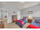 Well-lit bedroom showcasing two twin beds with matching furniture at 3510 Meadow Grass Dr, Dacula, GA 30019