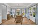Formal dining room with hardwood floors, elegant decor, and abundant natural light at 3510 Meadow Grass Dr, Dacula, GA 30019