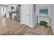 Open floor plan with a stainless-steel refrigerator and a door leading to the outside at 3510 Meadow Grass Dr, Dacula, GA 30019