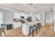 Bright, open kitchen featuring a large island with seating, white cabinetry, and stainless appliances at 3510 Meadow Grass Dr, Dacula, GA 30019