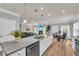 Open kitchen featuring a large island, granite countertops, and stainless steel appliances at 3510 Meadow Grass Dr, Dacula, GA 30019