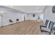 Living room featuring hard surface flooring and chairs, with doorways into other spaces at 3510 Meadow Grass Dr, Dacula, GA 30019