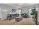 Comfortable living room with ample seating, a decorative area rug, and a mounted TV at 3510 Meadow Grass Dr, Dacula, GA 30019