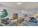 Cozy living room with comfortable seating and a view of the staircase at 3510 Meadow Grass Dr, Dacula, GA 30019