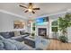 Inviting living room featuring a fireplace, large TV, comfortable seating, and natural light at 3510 Meadow Grass Dr, Dacula, GA 30019