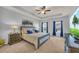A calming main bedroom features a tray ceiling, plush carpet, and abundant natural light at 3510 Meadow Grass Dr, Dacula, GA 30019