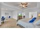 Bright main bedroom features a sitting area, tray ceiling, and access to the bathroom at 3510 Meadow Grass Dr, Dacula, GA 30019