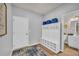 Mudroom entrance with bench, storage cubbies, and a convenient half bathroom nearby at 3510 Meadow Grass Dr, Dacula, GA 30019