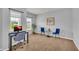 Bright office space featuring two windows, a desk, and comfortable seating for a productive work environment at 3510 Meadow Grass Dr, Dacula, GA 30019