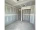A room under construction featuring bare walls and floors, awaiting transformation into a bedroom at 5106 Arista Dr, Douglasville, GA 30135