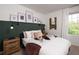 Beautifully decorated bedroom featuring modern decor, stylish lighting, and a comfortable bed at 5106 Arista Dr, Douglasville, GA 30135