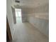 Unfinished hallway showing drywall, electrical outlets, and an open doorway leading to another room at 5106 Arista Dr, Douglasville, GA 30135