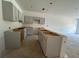 Bright kitchen featuring shaker cabinets, a center island, and ample space for cooking and entertaining at 5106 Arista Dr, Douglasville, GA 30135