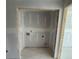 Unfinished laundry room with framed doorway and plumbing connections ready for washer and dryer at 5106 Arista Dr, Douglasville, GA 30135