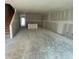 Unfinished living room showing walls prepped and ready for painting at 5106 Arista Dr, Douglasville, GA 30135