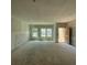 Unfinished living room showing walls prepped and ready for painting at 5106 Arista Dr, Douglasville, GA 30135