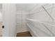 Walk-in pantry with wire shelving, offering ample storage for groceries and kitchen essentials at 5106 Arista Dr, Douglasville, GA 30135