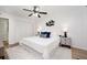 Bright bedroom with large bed, ceiling fan, closet, and neutral decor at 120 Alden Nw Ave # D2, Atlanta, GA 30309