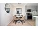 Charming dining area with modern decor, complemented by a round table and nearby kitchen features at 120 Alden Nw Ave # D2, Atlanta, GA 30309