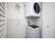 Functional laundry room equipped with washer, dryer, and storage shelves at 120 Alden Nw Ave # D2, Atlanta, GA 30309
