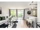 Bright living room with balcony access, modern furnishings, breakfast bar, and stylish decor creating a welcoming space at 120 Alden Nw Ave # D2, Atlanta, GA 30309
