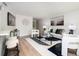 Cozy living room featuring modern decor, comfortable seating, contemporary artwork, and a stylish bar area at 120 Alden Nw Ave # D2, Atlanta, GA 30309