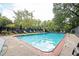 Inviting community swimming pool with surrounding mature trees at 120 Alden Nw Ave # D2, Atlanta, GA 30309