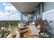 This covered balcony features comfortable seating and peaceful outdoor space with an open view of the city at 3344 Peachtree Ne Rd # 3601, Atlanta, GA 30326