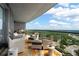 This spacious balcony features lounge seating, an outdoor grill, and incredible city views at 3344 Peachtree Ne Rd # 3601, Atlanta, GA 30326