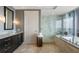 Luxurious bathroom featuring a soaking tub, glass-enclosed shower, and modern fixtures at 3344 Peachtree Ne Rd # 3601, Atlanta, GA 30326