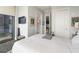 Neutral bedroom with balcony access, a walk-in closet, and modern design at 3344 Peachtree Ne Rd # 3601, Atlanta, GA 30326