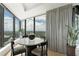 Breakfast nook featuring a contemporary table and chairs and a large window with natural light and city view at 3344 Peachtree Ne Rd # 3601, Atlanta, GA 30326