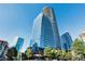 Stunning exterior view of a modern high-rise building with sleek glass architecture and surrounding cityscape at 3344 Peachtree Ne Rd # 3601, Atlanta, GA 30326