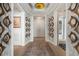 Elegant hallway featuring wood floors, decorative mirrors, custom lighting, and inviting entryway at 3344 Peachtree Ne Rd # 3601, Atlanta, GA 30326
