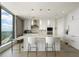 Modern kitchen with white cabinetry, marble countertops, stainless steel appliances, and stunning city views at 3344 Peachtree Ne Rd # 3601, Atlanta, GA 30326