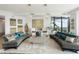 Sunlit living room with curved sofas, stylish decor, and city vistas providing a sophisticated ambiance at 3344 Peachtree Ne Rd # 3601, Atlanta, GA 30326
