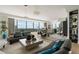 Bright living room with a modern sofa, stylish decorations and open floor plan offering natural light and city views at 3344 Peachtree Ne Rd # 3601, Atlanta, GA 30326