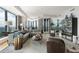 This spacious living room boasts floor to ceiling windows and high-end decor and comfortable seating arrangement at 3344 Peachtree Ne Rd # 3601, Atlanta, GA 30326