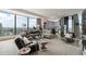 Bright living room features expansive windows with city views, modern furnishings, and neutral color palette at 3344 Peachtree Ne Rd # 3601, Atlanta, GA 30326