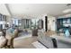 Well-lit living room showcasing large windows with city views, modern decor, and comfortable seating at 3344 Peachtree Ne Rd # 3601, Atlanta, GA 30326