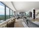 Spacious living area with floor-to-ceiling windows offering stunning city views and stylish, modern decor at 3344 Peachtree Ne Rd # 3601, Atlanta, GA 30326